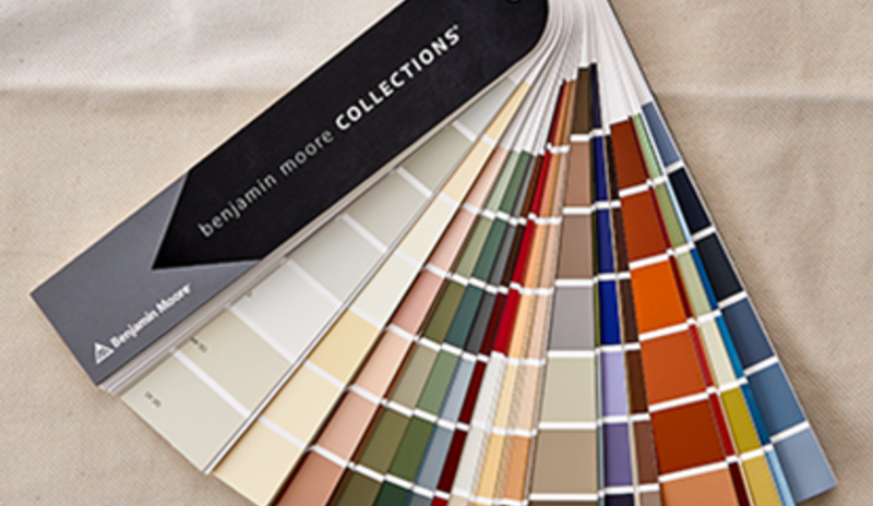 A Benjamin Moore fan deck sitting on a table
